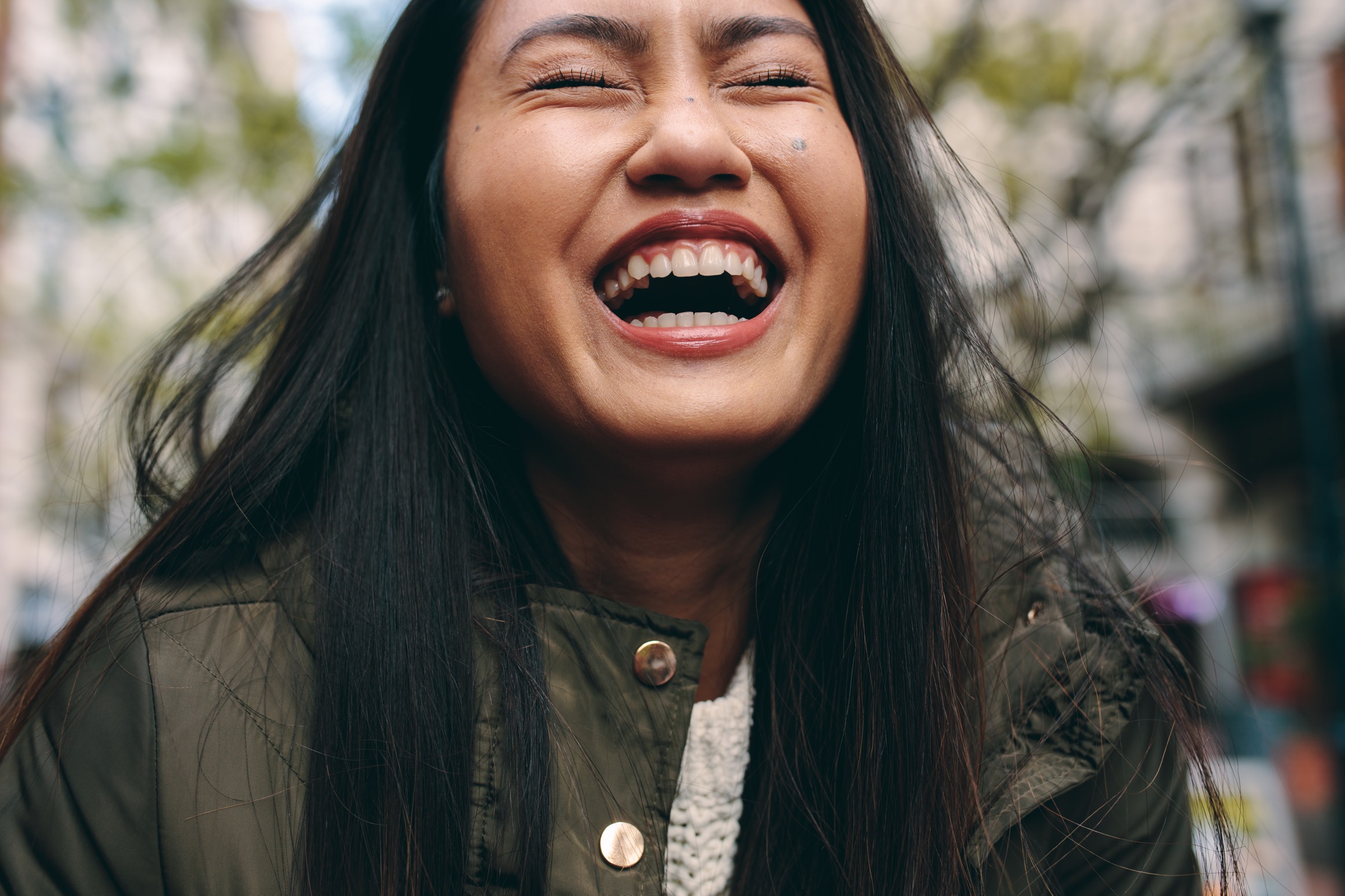 Woman laughing with her mouth open